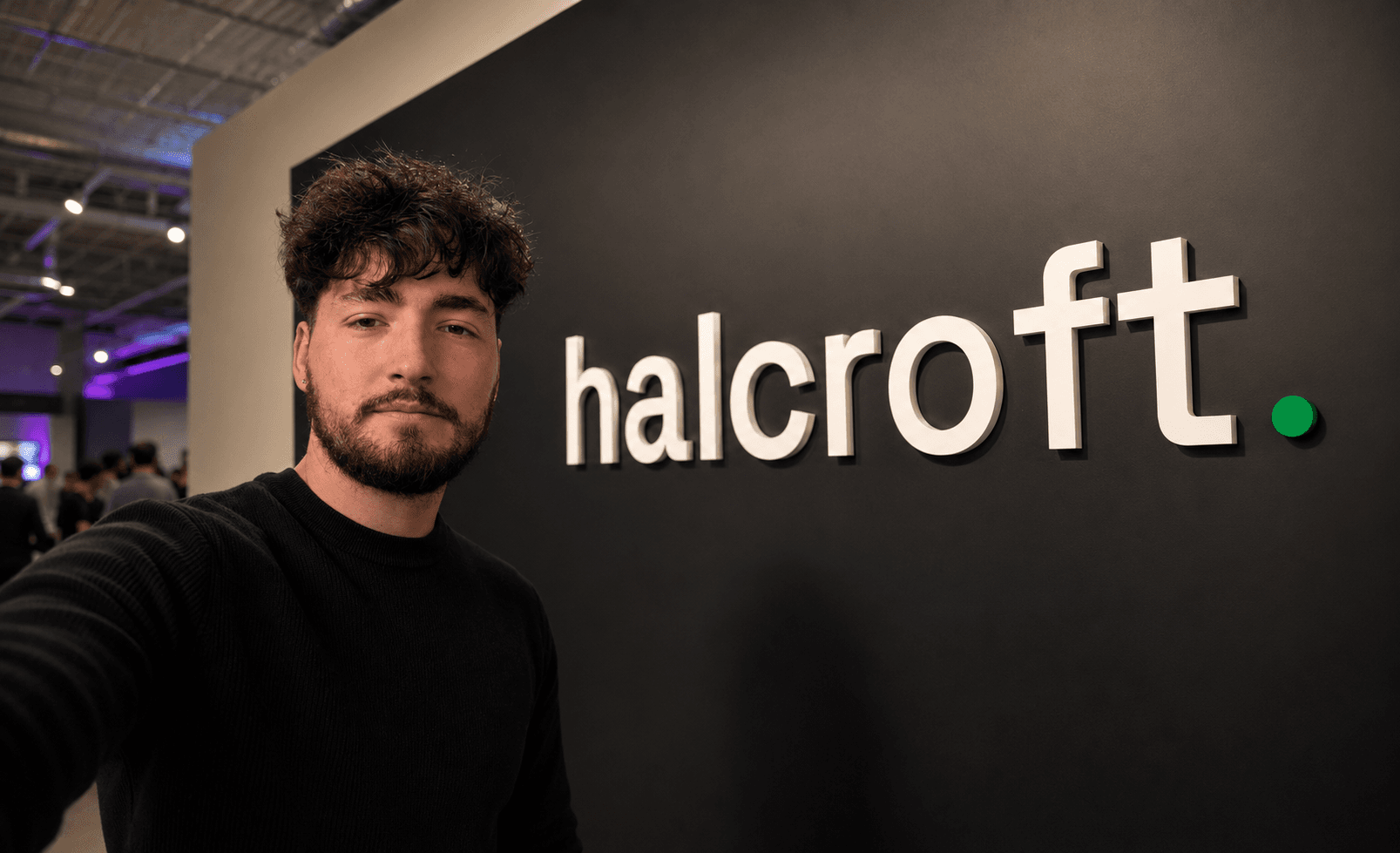 Harry Clancy, founder of halcroft, beside the halcroft wordmark